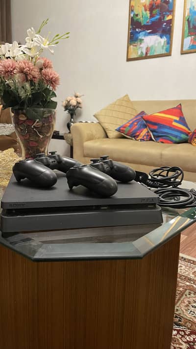 PS4 Slim 1TB Original + 2 Controllers – Complete Setup – Rs 40,000