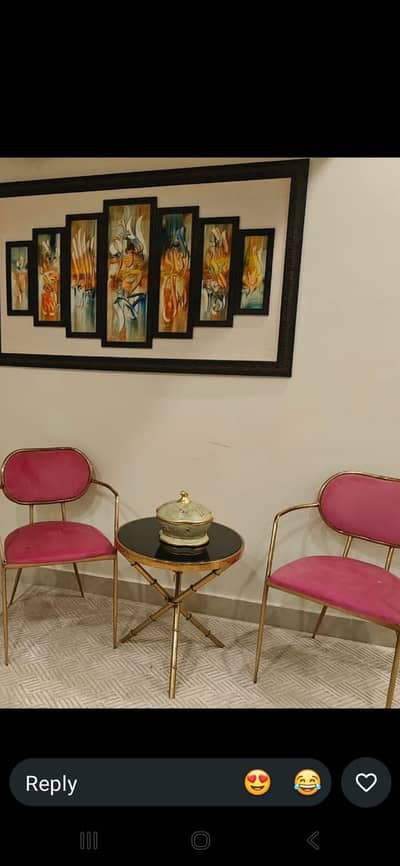Pink color chairs table and frame