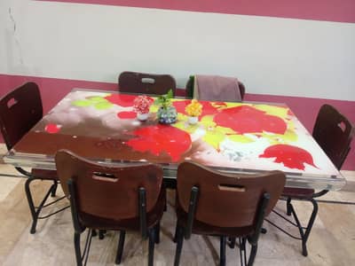 six seater dinning table and wooden iron chairs