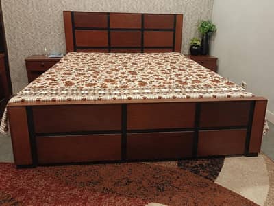 bed with side tables and dressing