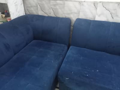 L shape sofa in blue color