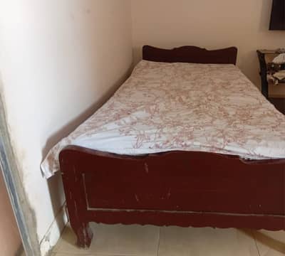 wooden single bed without mattress
