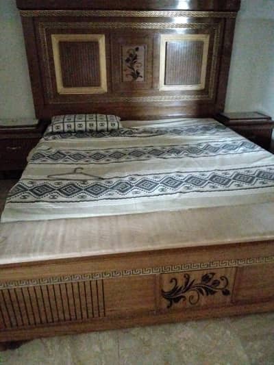Bed, side table and foam