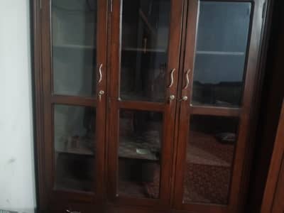 Price negotiable . Only serious cntct 3door wooden cupboard for dishes
