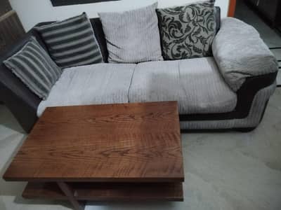 heavy wooden table and 3 seater comfortable sofa