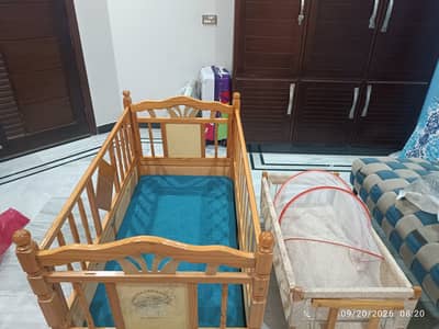 Baby wooden cot plus bed.