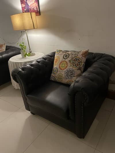 Seven seater black leather sofa