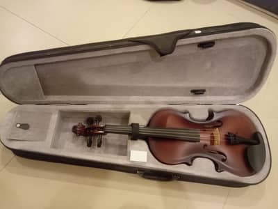 Well Tuned Violin along with the orginal casing and Rosin.