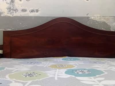 Queen bed with side table
