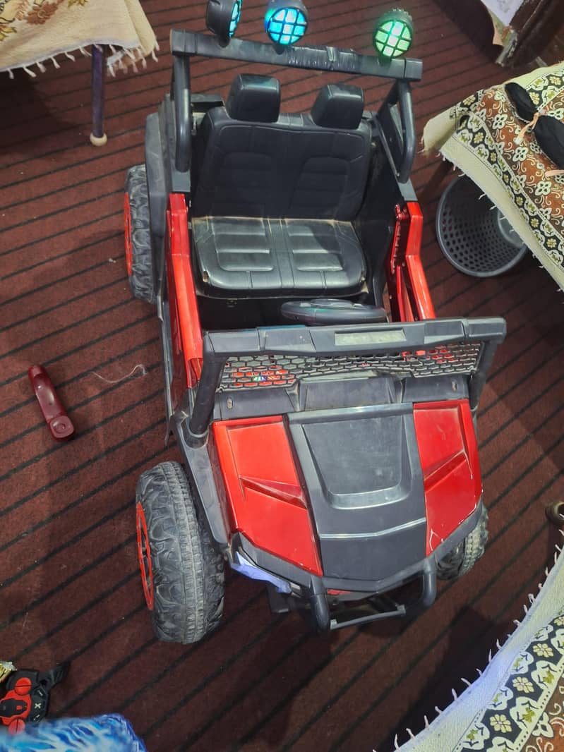 electric kids jeep car_ black & red | manually operated |  8/10 condit 1