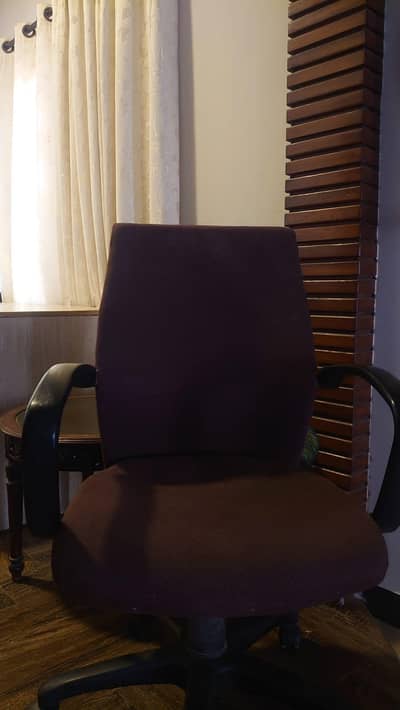 office revolving chair and a computer table, with a drawer.