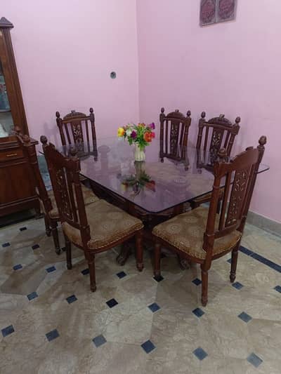 5 years old good condition chinioti dining table with  06 chair & glas