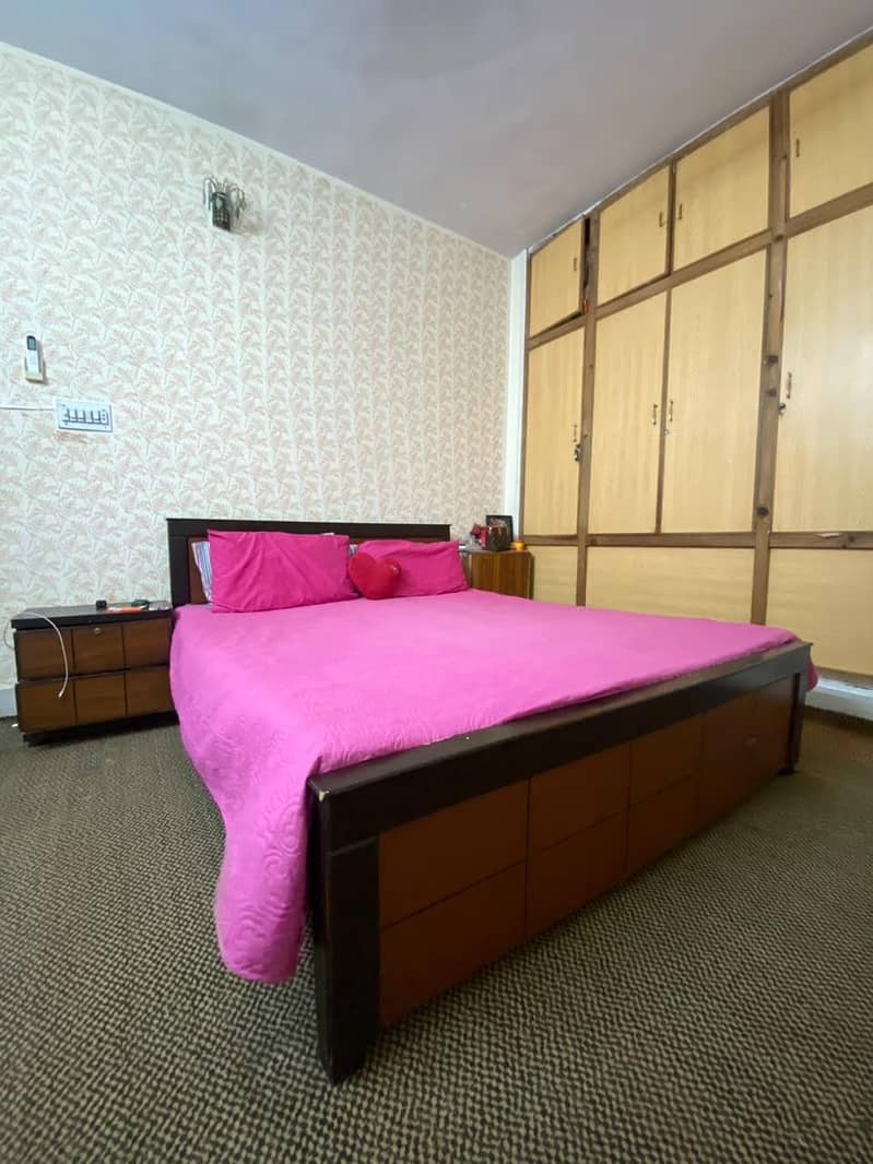 bed with one side table 0