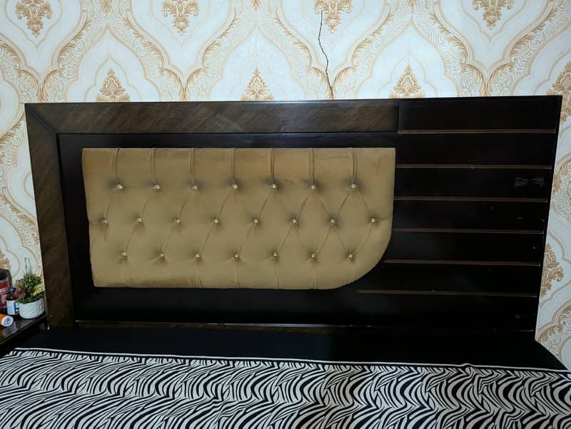 large size bed with a side table. 2