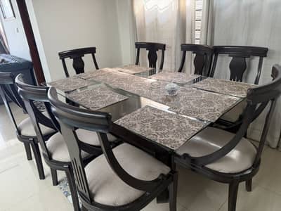 Solid wooden dining table with glass top and 8 chairs