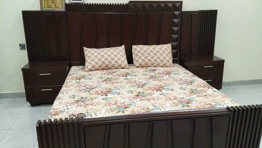 wooden bed and dressing