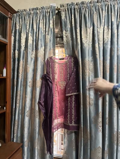 A lilac color kameez trouser