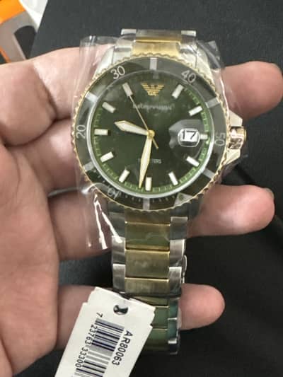 Emporio Armani world Explorer green Sunray dial 2 tone