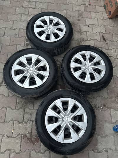 Corrolla 15inch rim and runway tyre 80% tire condition