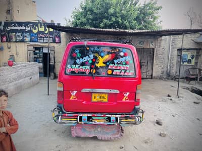 red Toyota Hiace van