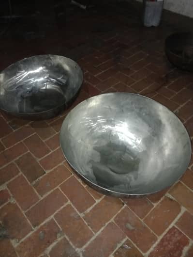 2 Heavy karai , Stainless steel which weight is around 30 kg each .