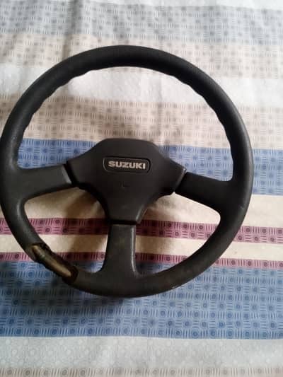 Staring Wheel Sports Suzuki Jeeps n Cars.