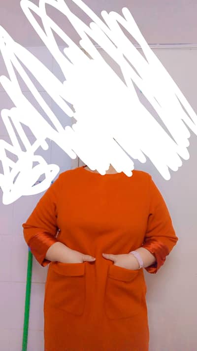 A burnt orange colour long sweeter