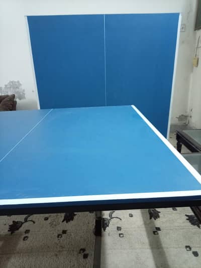 table tennis with blue coat
