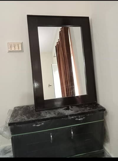 dressing table and bed with two side tables