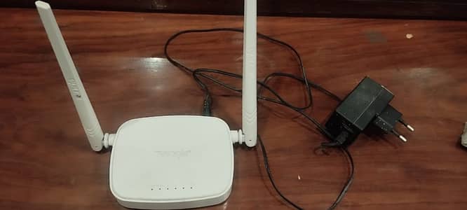 Tenda Wifi Router with adopter slightly used