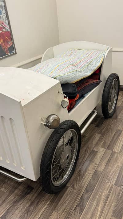 white vintage car-shaped children's bed