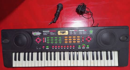 54 Keys piano with built in instruments, with Mic and adapter for sal