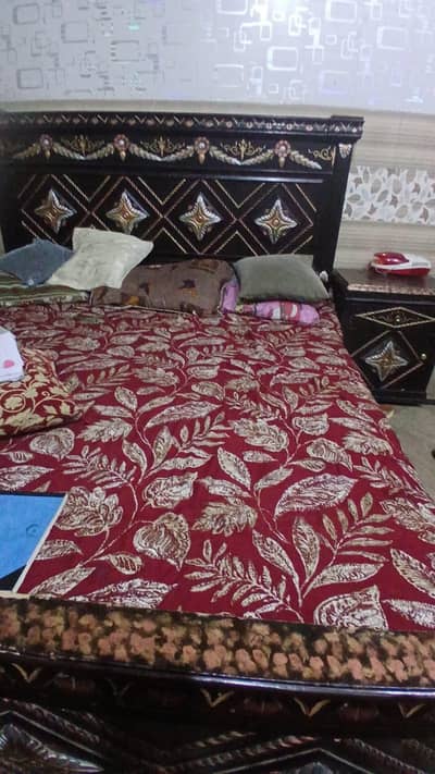 heavy, real wooden bed with the mattress.