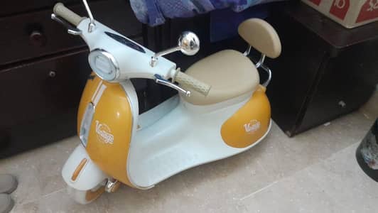 Kids vespa scooter