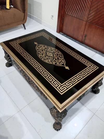 sofa center table in new condition. black color. with golden touch