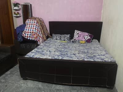 Wooden Bed with Spring Mattress – Good Condition
