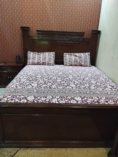 Bed with side tables and dressing table