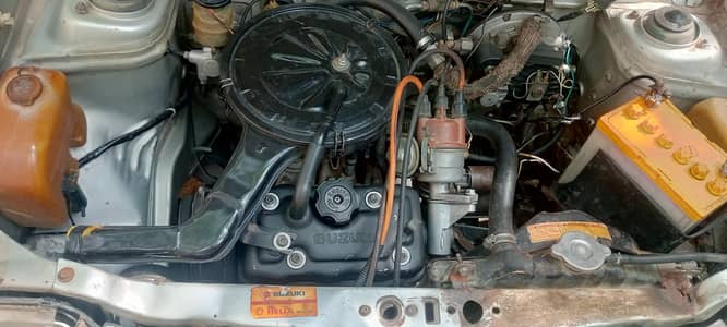 Suzuki mehran 2005 silver.  Sindh reg alloy rims Islamabad
