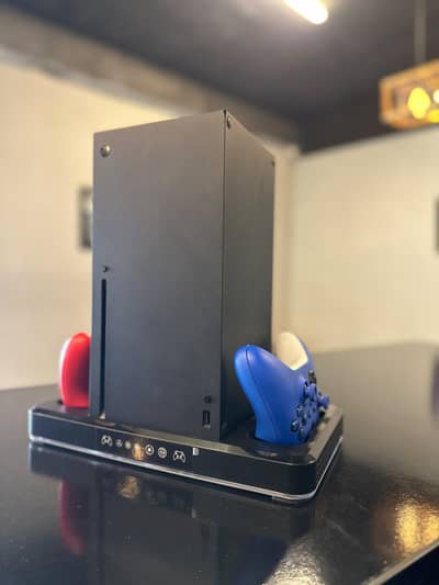 Xbox Series X Console with 2 controllers and cooling+charging dock.