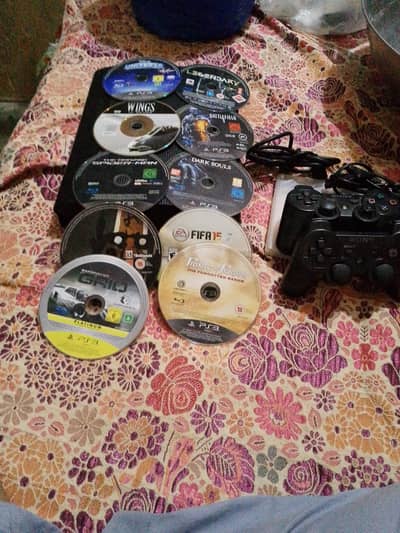 PS3 l 2 controllers 10 CDs with GTA 5 jailbreak