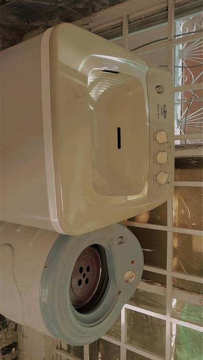 washing machine and dryer in used
