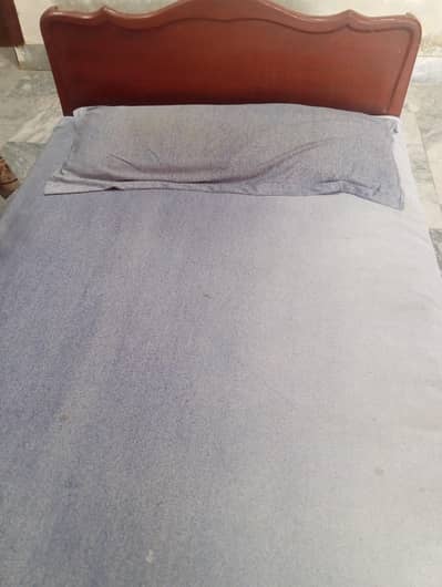 wooden single bed