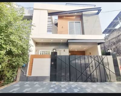 7.5 Marla Brand New Luxury Modern Style Triple Storey Super Hot Location 65 Feet Road With Direct Owner Available For Sale in Johar Town Phase 2 Near Emporium Mall.