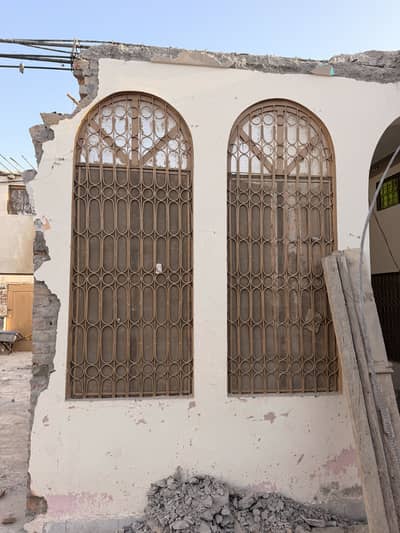 Iron Windows Made of T. R and Diyar Wood Panels