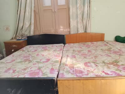 2 Single Beds with Mattresses – Rs. 25,000