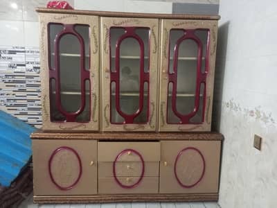 Beautiful 3 door wooden Almari with glass door and drawers.