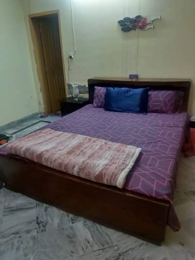 Solid Wooden Double Bed with Headboard Storage – Good Condition