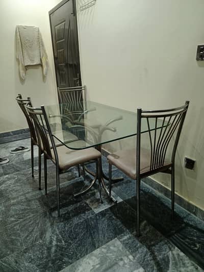 6 chair dining table with heavy glass top and steel chair