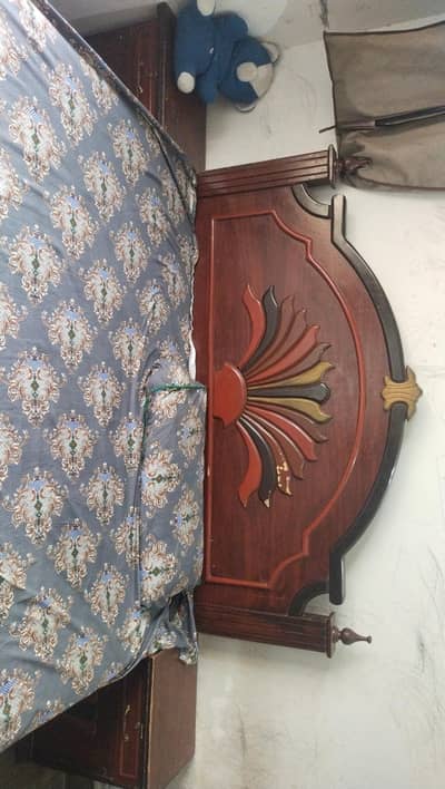 wooden bed with metress. .