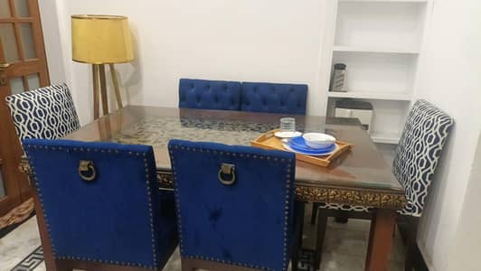 modern 6 seater dining table set with glass top and royal blue velvet